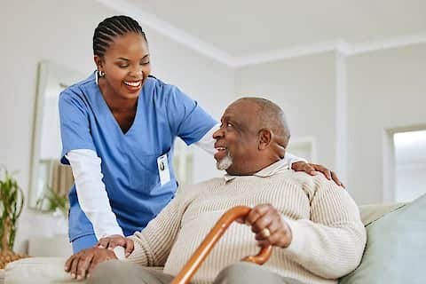JASBEK nurse supporting a client at home.