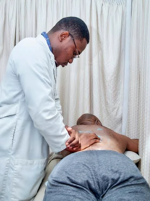 Physiotherapist providing hands-on manual therapy support.